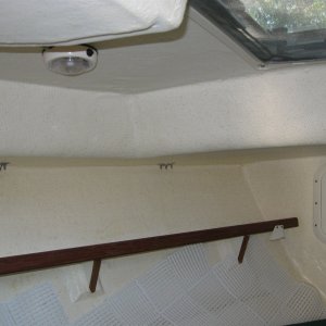 V-berth showing vent tiles that extend under cushions.