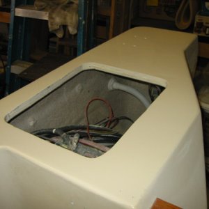 starboard lazarette.  More fine sanding, another coat, and install cover.