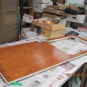 door refinish, sanded all laminate off, and repaint and reseal -- door latch mechanism corroded and could not be removed -- worked around as good as possible