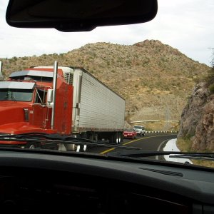 Meeting a transport truck on a corner is nerve wracking - notice how far over the white line edge we are which means the boat trailer is even over more.  The white is not snow - short term extra piece