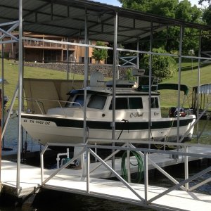 At home.
Except for a few C-Brat gatherings spent the rest of it's time in fresh water. 
Stored on lift in covered slip with @520 hours. That's as close as you can get to "Only to church on Sundays"