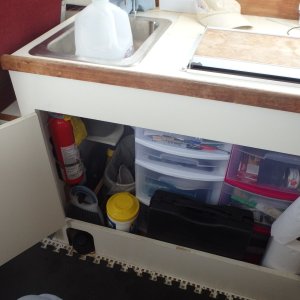 Under the sink and stove