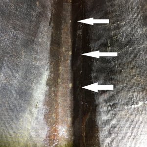Fiberglassing over keel guard screws.