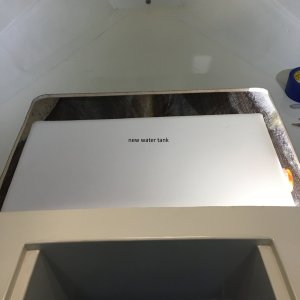 Test fitting the new 12 gallon water tank in the forward V berth.