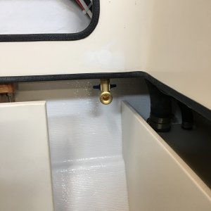 Potable water hose bib installed, connected to water pump in the V-berth, used for rinsing off feet after beach combing.
