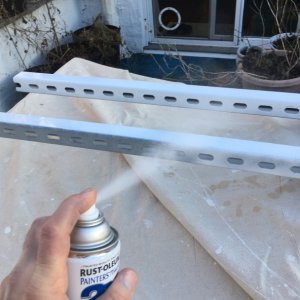 this cheap project came together when I dumpster dove some long lenghts of 12-Gauge Electro-Galvanized Half Slot Steel Strut Channel which I painted white. I don't consider this a permanent fixture on the boat otherwise I would have sourced some sort of aluminium or even SS chanel