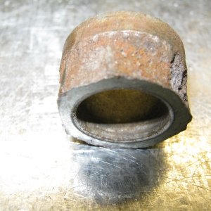 Lip of bushing sheered off under load.