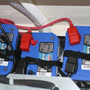 Media 'Three batteries (installed by the dealer) two starting batteries (34M Optima) and one 'house' battery (D34M Optima) located beneath the port forward dinette seat - behind the refrigerator.' in album 'Three batteries (installed by the dealer) two starting batteries (34M Optima) and one 'house' battery (D34M Optima) located beneath the port forward dinette seat - behind the refrigerator.'