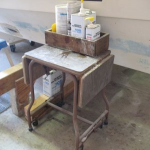 feb. 2011 051 garage sale find! Old typewriter stand - rolls and locks in place. Bonus drop-leafs! Best damn epoxy work station ever!!!