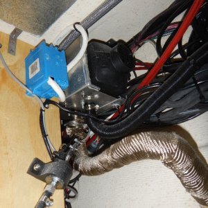 Exhaust. Used old Wallas exhaust hole,added new stainless thru-hull. Wrapped tube with car engine header wrap.