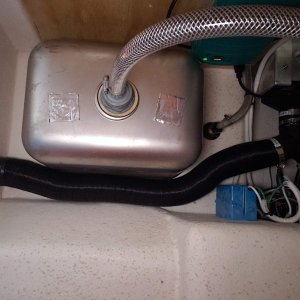 Unused space beside sink was perfect for Espar hose run. Outlet is waist level in cabin - not ideal, but on this boat, not possible to run the hose down to floor level.