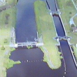 Media 'Ortona Lock: Lock chamber:50'x250'- Vertical lift: 7.5' to 8.5'- Discharge capacity 8,600 cfs(cubic feet per second)Operates daily 6:00A to 9:30P-Marine VHF radio Channel 13-Located at Okeechobee Waterway 
statute mile 93.5' in album 'W.P Franklin Lock: Lock chamber:56'x400'- Vertical lift:Sea level to Caloosahatchee River, 2' to 3'- Discharge capacity 28,900 cfs(cubic feet per second)Operates daily 6:00A to 9:30P-Marine VHF radio Channel 13-Located at Okeechobee Waterway 
statute mile 121.4  NOTE: The Okeechobee Waterway ends/starts at Day Beacon #101, in San Carlos Bay.'