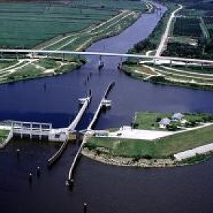 Port Mayac Locke: Lock chamber:56'x400'- Vertical lift: Diffenence between St. Lucie Canal water level and Lake Okeechobee 1/2' to 2' (sometimes it is a "pass thru")- Discharge capacity 14,800 cfs(cubic feet per second)Operates daily 6:00A to 9:30P-Marine VHF radio Channel 13-Located at Okeechobee Waterway 
statute mile 39.0