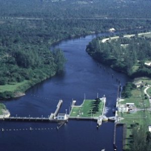 St. Lucie Lock: Lock chamber:50'x250'- Vertical lift:Sea level to current St. Lucie Canal water level 14.5' normal. Operates daily 6:00A to 9:30P-Marine VHF radio Channel 13-Located at Okeechobee Waterway 
statute mile 15.5