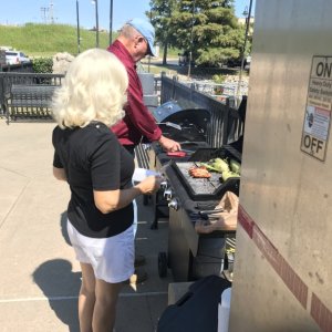 Red and white hots on the grill. Terry and Debby