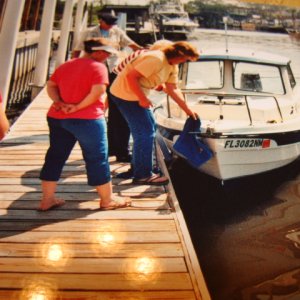 Laura cleans glass off the bow observed
by Debbie, Kellie and Ashley