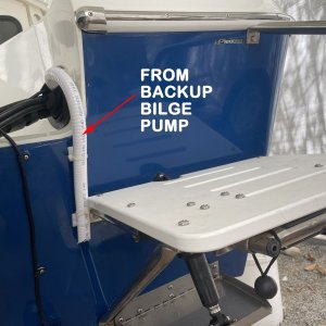 didn\'t want to combine with primary pump or make new thru hull so I ran the hose through to transom via the engine control boot