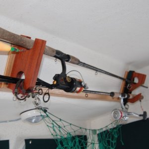Rod holder mounted with bolts from top rail no holes drilled