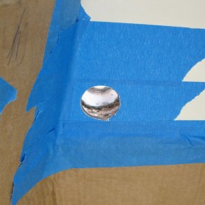 Transom side of empty hole.  What you are seeing is the balsa core of the transom, followed by the forward fiberglass skin of the transom, and then the (white) filler that fills the gap between the splashwell molding and the forward transom skin.