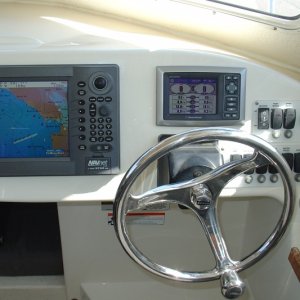 Media 'Furuno Navnet Radar-Plotter-Fishfinder and Mercury Vessel View Display.  Also added stainless Edson Wheel with Power Knob.' in album 'Remove all switches, gauges, displays'