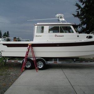 Media 'Dreamer still moored in the driveway.  Neighbors haven't complained yet..  Most have come over for a tour.' in album 'Surprise! Unexpectedly, Boat is near completion, a month early.'