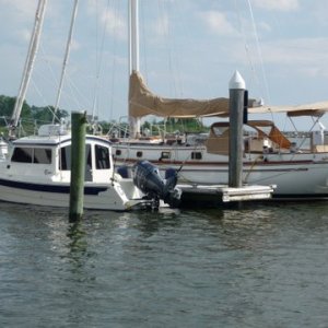 Media 'P1000347 In Good company, that is a Shannon that we are docked next to, a hand built world class 52' sailboat. The people had been out for two weeks in the Chesapeake. When they came off for dinner they were dressed immpeciably not a wrinkle. What a boat!! Check out www.shannonyachts.com  to get idea of what that boat represents. They are still a busy boat builder in R.I.' in album 'P1000334 Gin Mill to the right of the ramp. So much for safe boating. Same place shown later in a picture taken from Will-C's cockpit in a night photo'