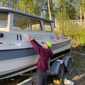 Applying the new name, vinyl sticker from Boats US