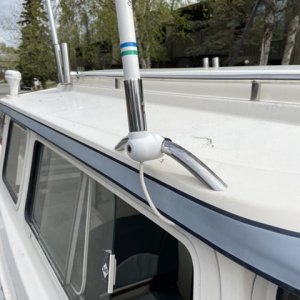 New location for antenna. Added a SS rail that mounts outside of cabin wall on overhang so there is no cabin penetration (to leak). Also allowed me to use a very low profile rail mount which I like. I could not find a roof mount small enough that it did not require me to drill holes into the cabin. Not that I don?t have some already but less is better.