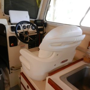 It is a Tempress Elite High Back version. It was big bucks, but I figured I'd be spending a lot of time here. Note clearance to counter - no swiveling possible.  Used same piece of plywood from the other seat underneath to get perfect seat height.