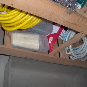 Remodel cave... two 39 inch plastic bins. Both slides under leaving all the space under shelving open