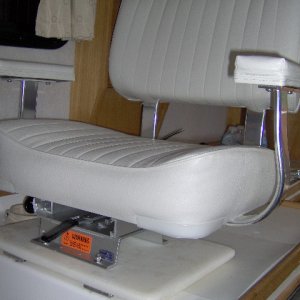 Swivels and slides, raises seat about 5 inches