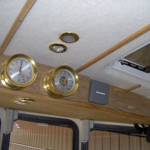 Put on teak doors on both sides.