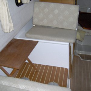 I'm going to sleep here, table top will go to the v-birth in the morning. It sure opened up the galley. we will leave the legs for the table at home. Two teak tv trays. one in cock pit , one in cabin.