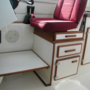 Shelf below helm seat. 10" tall storage for shoes or whatever. Makes a comfortable footrest.