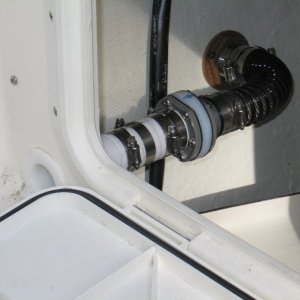 (Sea Skipper) Scuppers enlarged to 1-1/2? with modified check valve to prevent wave induced back flow into cockpit.  Thanks Les of EQ Marine for the parts!