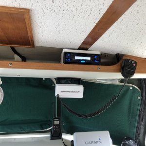 Stereo installed on shelf above helm