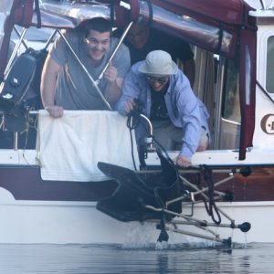 Austin and Jared triumphantly retrieve a chair from the briny deep. How did it get there? That must forever remain a secret of Pirates' Cove . . .
