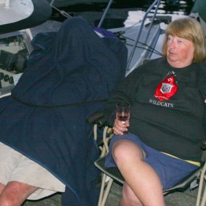 Pat catches some Z's while the group chats. Note that someone -- believed to be a relative -- has tied him to his chair.