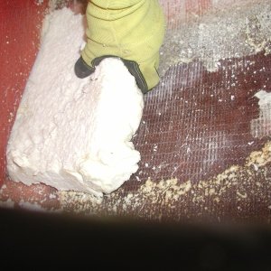 Cut it out with a hand saw then sanded with an orbital palm sander