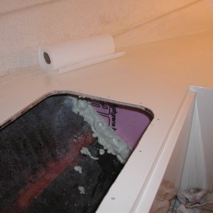 Media 'Shoved the front compartment full of foam and installed a pink foam bulkhead to hold it. I used some filler foam till the forward compartment was full. Note the 6" access I cut.' in album 'Apx 2 cu ft of foam per side'