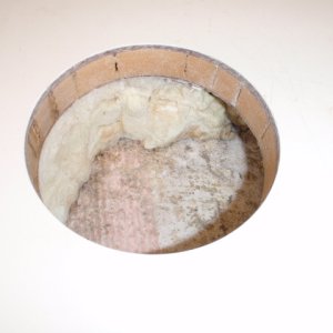 4 1/2\" hole cut for deck plate between fuel tanks.  On the left side you can still see moisture in the core foam.  This is after several days.