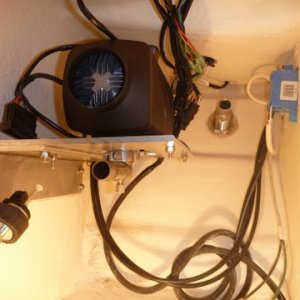 Extra wires behind and below heater are from my binacle control. You know the forward reverse and thottle for the outboard motor, fuel pump on lower left, combustion exhaust w drain centered, drilled and installed new thru hull