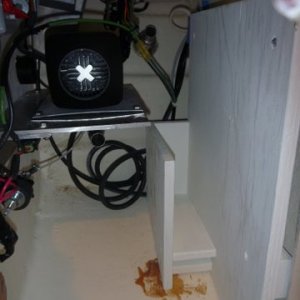 FUEL TANK RACK FOR EASY REMOVAL FUEL TANK HOLDS 2 1/2 GALLONS,HELD IN PLACE BY ONE BOLT. BROWN STUFF ON THE BOTTOM WAS FROM SOME FACTORY GLUE AS THEY HAD A SUB FLOOR GLUED IN TO MAKE IT FLAT FOR THE FACTORY INSTALLED REFRIDGERATOR. CHISELED WOOD OFF