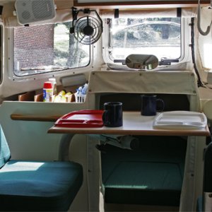 Media 'Copilot Seat in Dining Position' in album 'BEFOFE: Original port bench seat with copilot chair for CD 22 Commuter version. Starboard side was identical. This side now has been modified to form a bed and houses a 20 gallon water tank.'