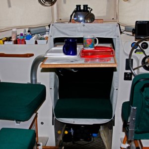 Table rotated lengthwise;it can be swung toward the aft direction and used as a counter surface if the galley is being used to cook for more than a couple of brats.