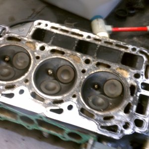 3 cylinder  40hp  honda new head gasket and carb cleanout