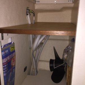 Aft cabinet with custom shelf and spare prop