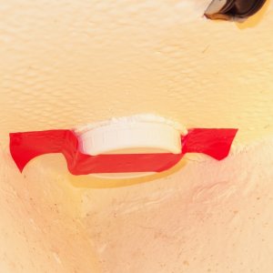 It is then taped over the fittings.  The foam expands, insulating the fittings and keeping them from dripping condensation.  This is the bow roller and you can just see the thru deck block before the hawse pipe was installed.