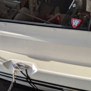 I used the heat gun with flat directing nozzle and a wide putty knife for removal.  Slow and steady, let the heat do the work, no gelcoat damage.  The cape cruiser name had been there for 14 years.  A light scrub with acetone removed all the glue and adhesive residue.  A quick buff with sopay water, then windex removed all the acetone. Water side vs dock side was a little dicey for all steps.  Should have reversed the boat in her slip for the starboard.