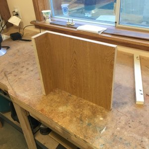 This piece goes aft of the new helm chair.